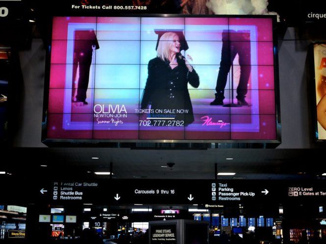 Large digital screen showing Las Vegas show advertisement
