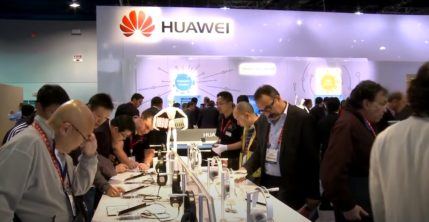 Huawei booth at VES with attendees looking at electronics