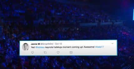 Tweet about Tableau keynote halleluja moment coming up placed on blue image of large crowd at event