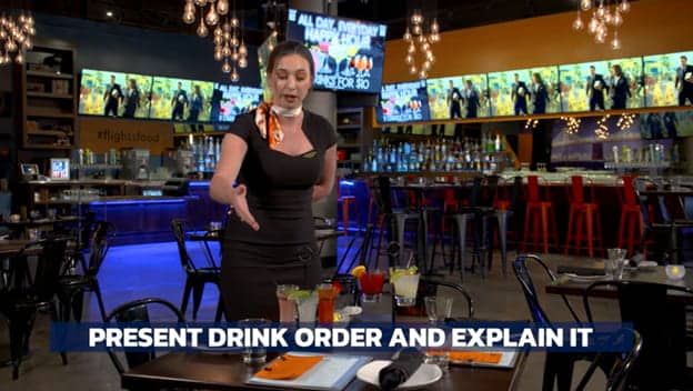 Photo of woman in a restaurant taken from training video
