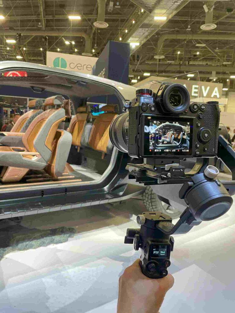 Cameraman recording cars