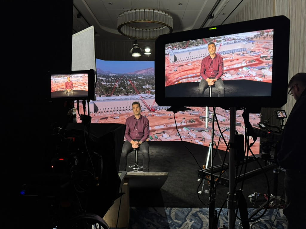 Behind-the-scenes view of a corporate video shoot with professional cameras and monitors, showcasing modern trends in corporate video production.